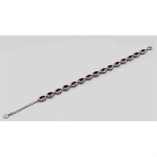 Beautiful bracelet with tear drop shaped and red and white zircons on the chain.
