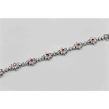 Beautiful bracelet with center flowered shaped orange zircon