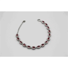 Beautiful bracelet with tear drop shaped and red and white zircons on the chain.
