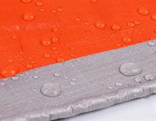 PLASTIC TARPAL (ORANGE/SILVER)100% WATERPROOF.USED FOR SUNSHADE AND OTHER OUTDOOR ACTIVITIES.